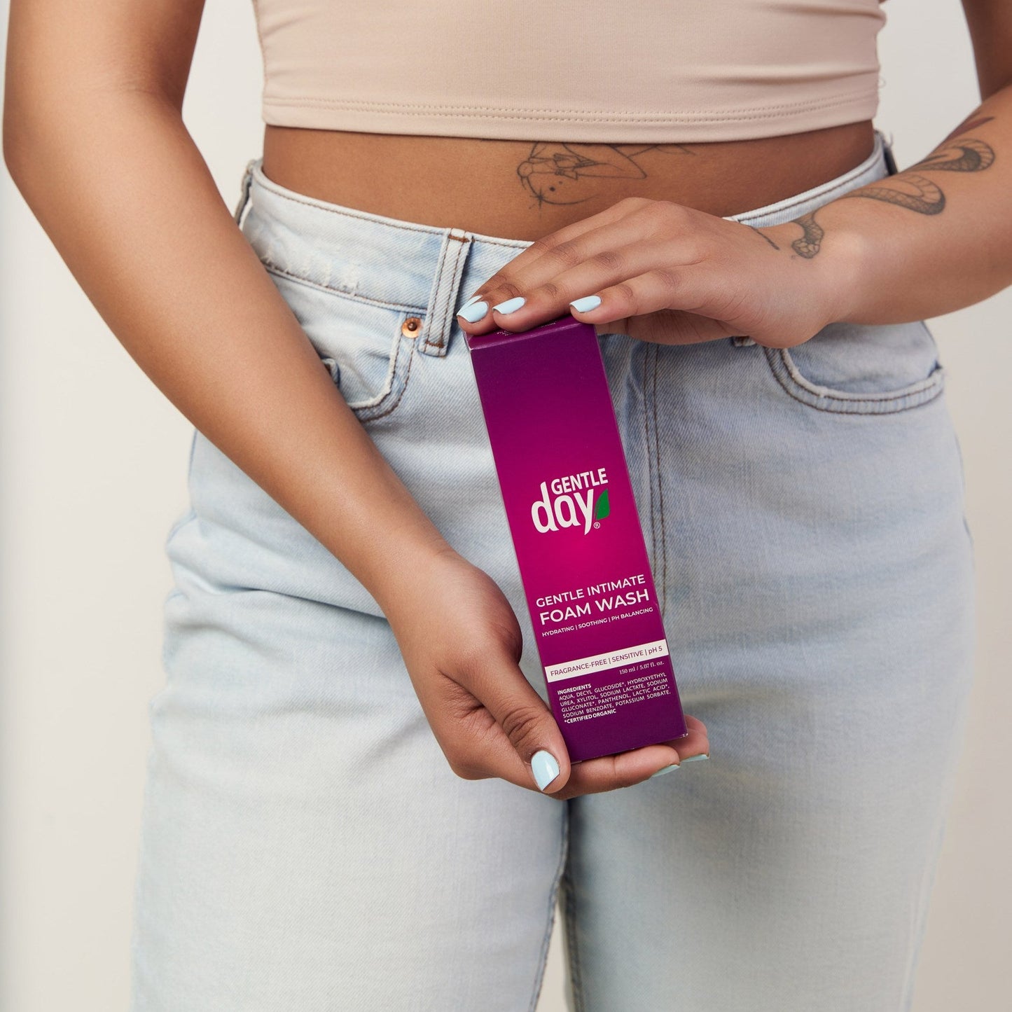 Woman holding Gentle Day intimate hygiene foam box